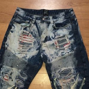 There tethered up ripped jeans they have American flags patched inside the holes